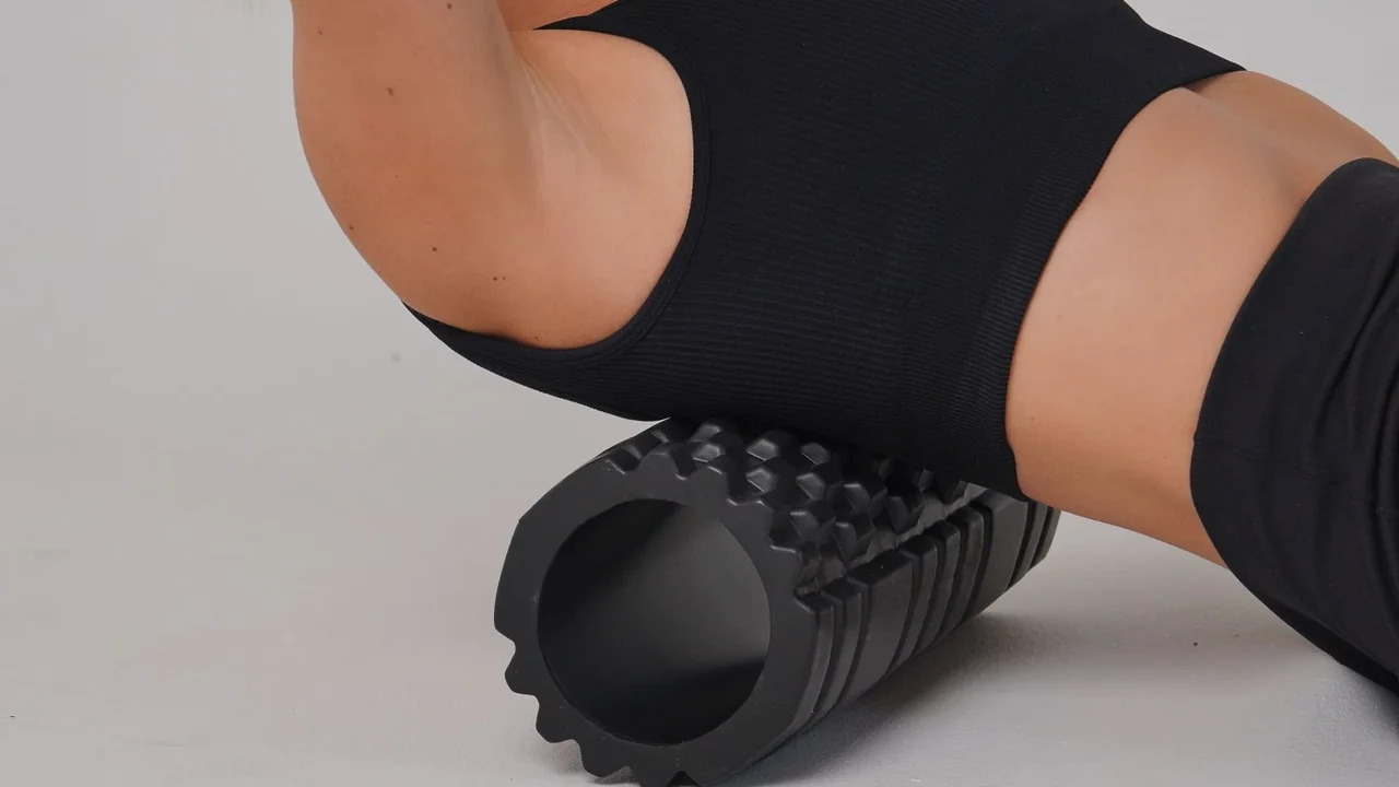 A foam roller supporting the upper back during exercise