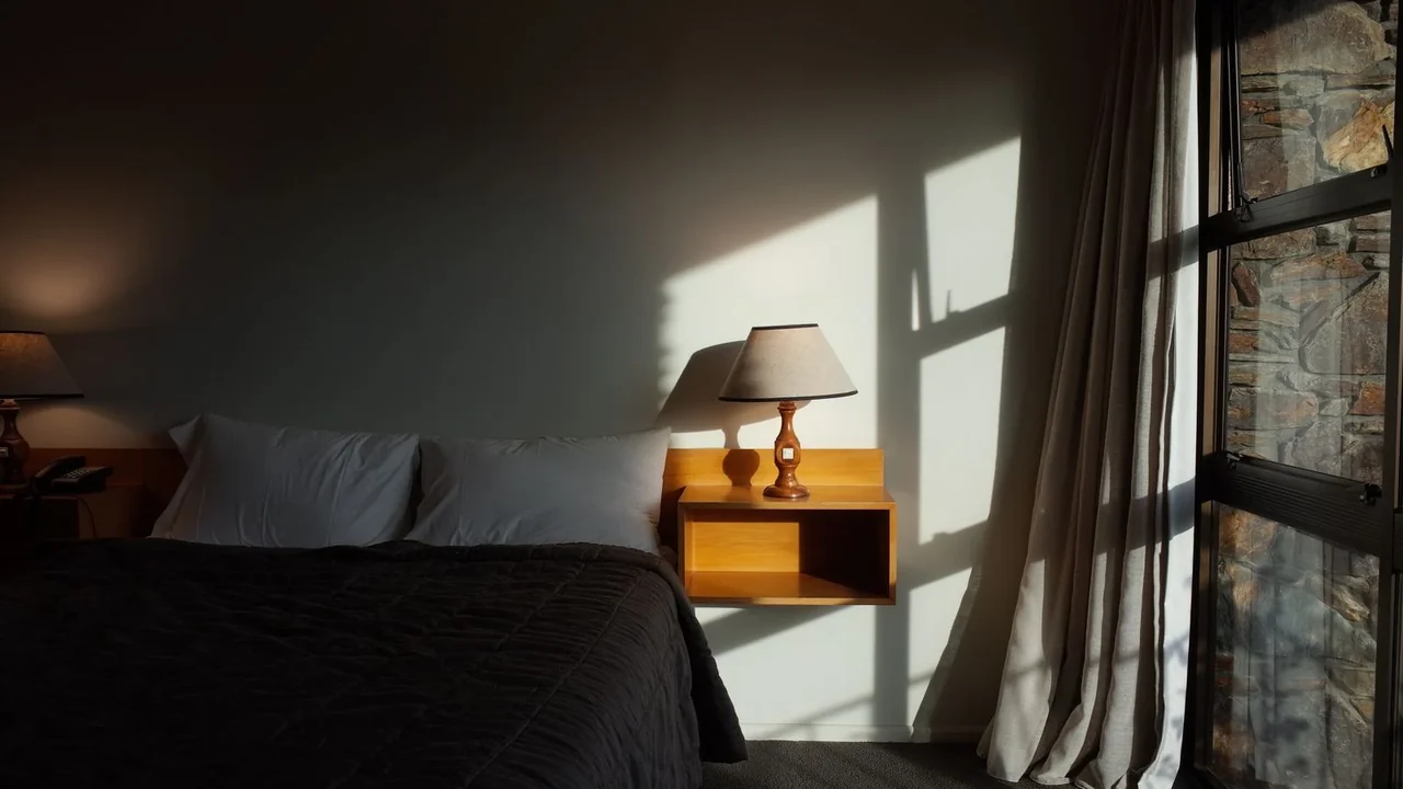 A quiet bedroom with daylight by the window
